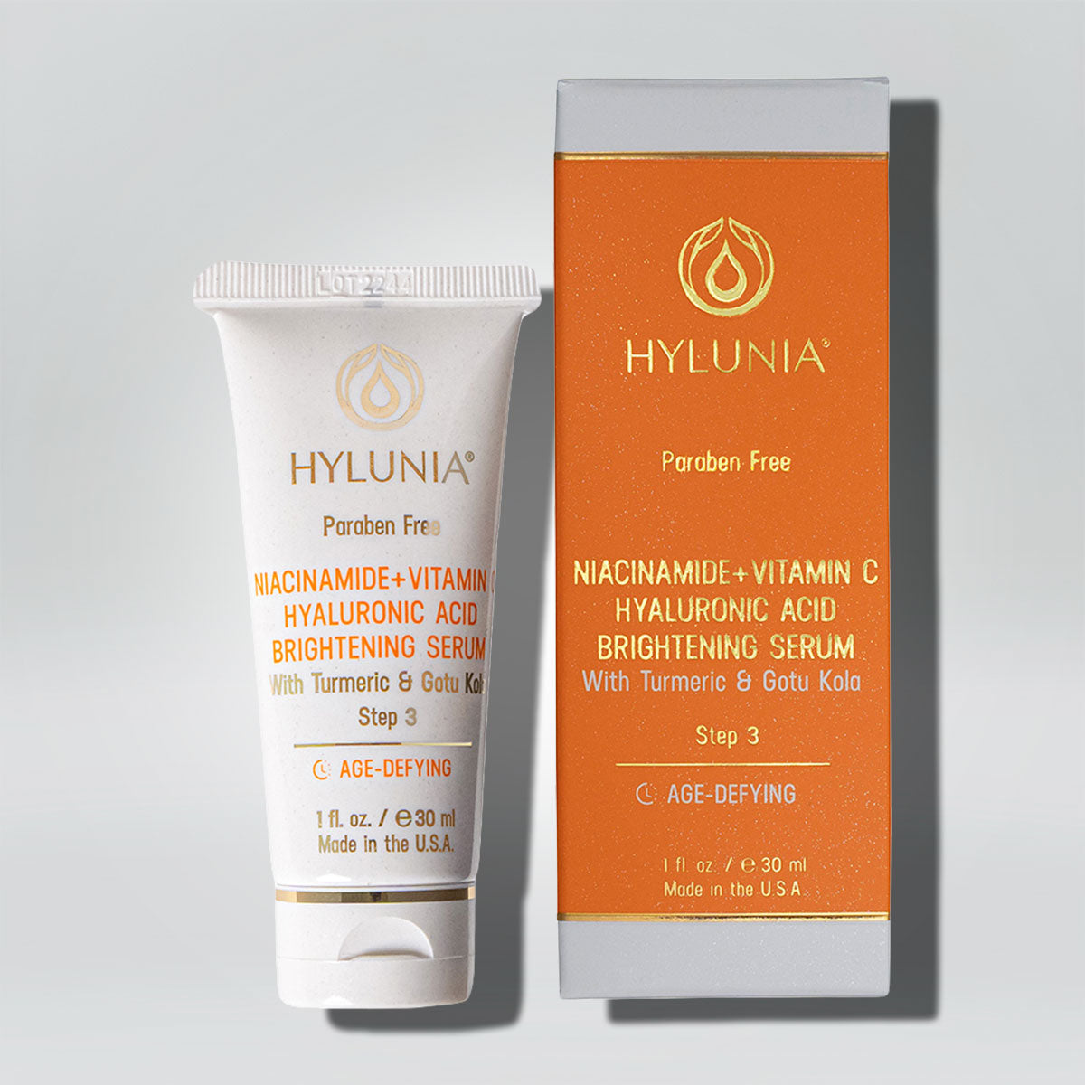 Niacinamide + Vitamin C Hyaluronic Acid Brightening Serum by Hylunia in a tube with an orange box, age-defying formula.